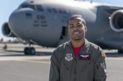 Capt. Jeff Jordan, 321st Air Mobility Operations Squadron, poses in front of a C-17 Globemaster III.