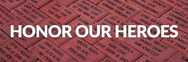 Pavers from the Airman Heritage Foundation Legacy Paver Program saying "Honor Our Heroes."