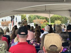 Civilian and military members listen to guest speakers at the Military Working Dog Teams National Monument Commemoration.