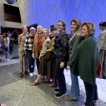 Hundreds of concert-goers posing with the AHF team before and after the concert.