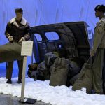 Close-up of display depicting the off-loading of duffle bags full of coal at Templehof Airport, Berlin.